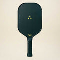 Black pickleball paddle with yellow text on a beige background
