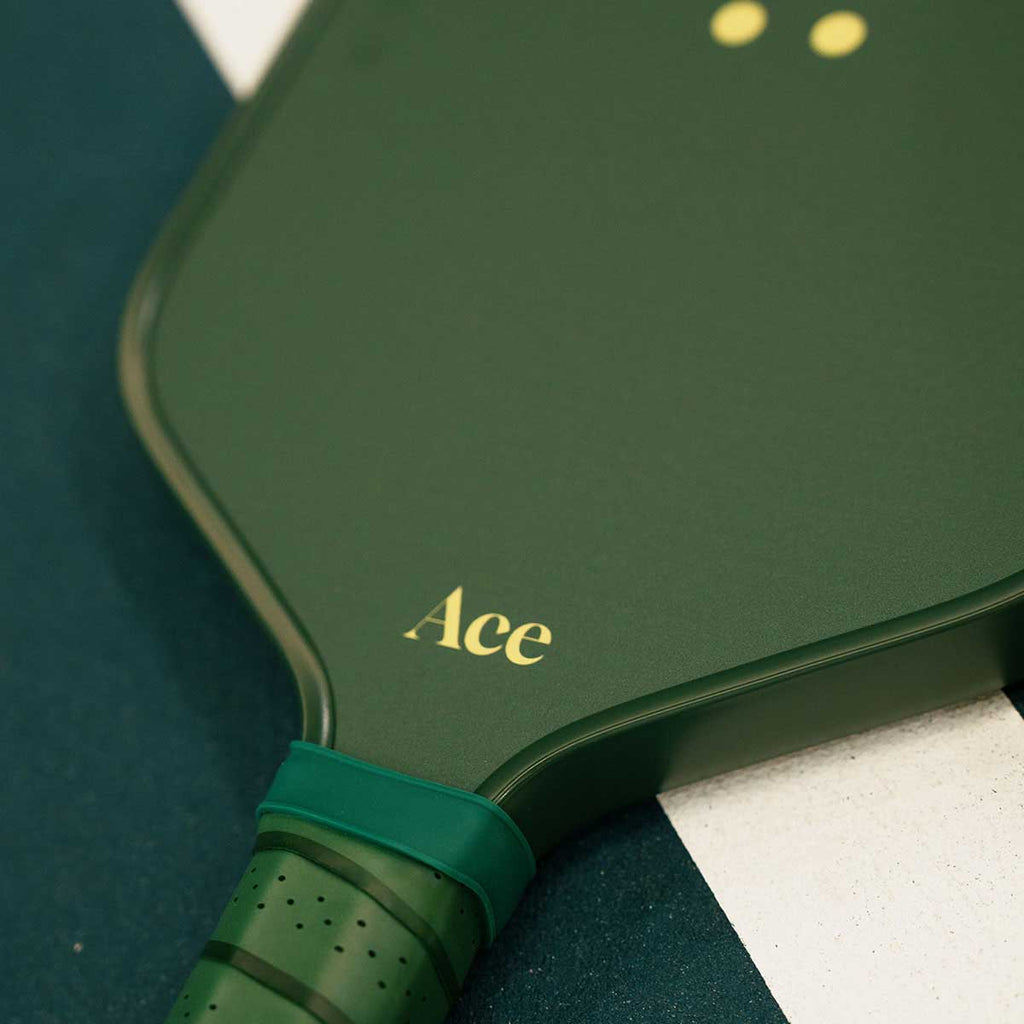 Green pickleball paddle with 'Ace' branding on a blue and white background
