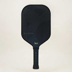 Black pickleball paddle with 'Ace' branding on a beige background